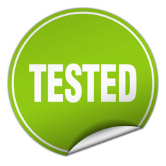 tested round green sticker isolated on white