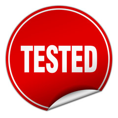 tested round red sticker isolated on white