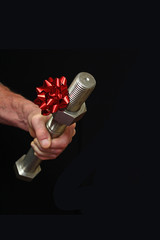 Man Holding a Big Bolt with a Red Christmas Bow.