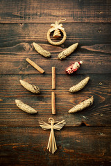 Abstract Christmas tree made of cones, cinnamon and decorations