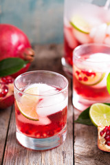 Pomegranate cocktail with lime slices