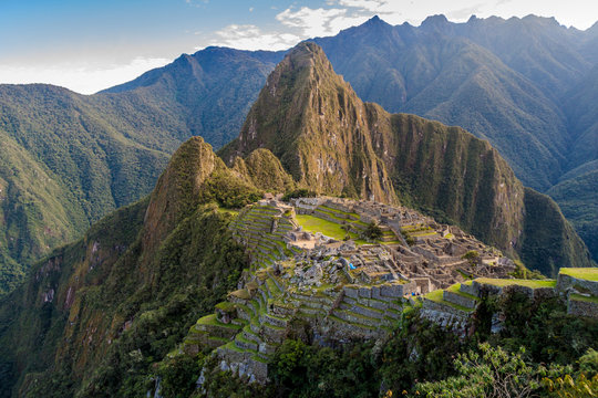 Aerial view of famous Machu Picchu ruins, Wayna Picchu mountain in the background.