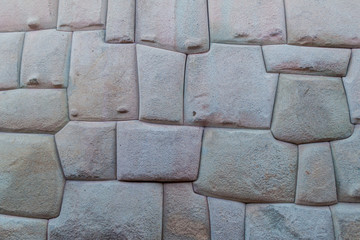 Detail of Inca's perfect stonework. Wall of former palace of Inca Roca in Cuzco, Peru.