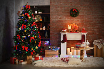 Fireplace with beautiful Christmas decorations in comfortable living room