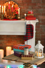 Fireplace with beautiful Christmas decorations in comfortable living room