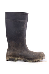 Muddy rubber boot side view isolated on white background