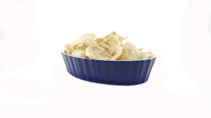 Crisp rice in blue bowl on white background