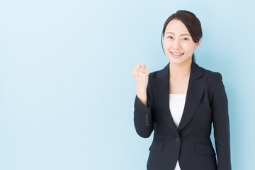 portrait of asian businesswoman on blue background