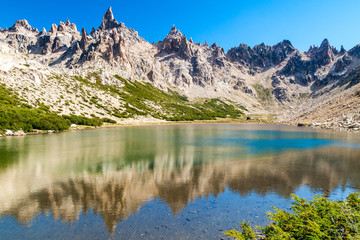 Mountains reflecting in Laguna Toncek lake near Bariloche, Argentina