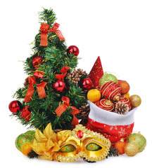 New year composition with christmas tree, santa claus bag full of toys and carnival mask
