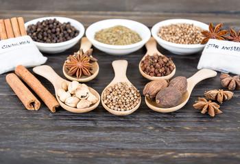 Spices and herbs in  bowls.