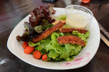 close up fish fingers, fish stick served with fresh vegetable an