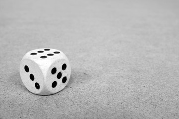 white playing die close-up monochrome