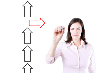 Businesswoman drawing arrows in different directions.