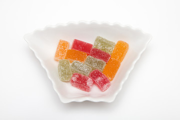 marmalade in sugar in plate isolated on white