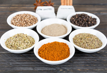Spices and herbs in  bowls.