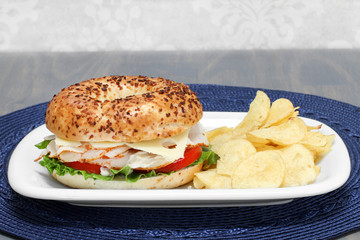 Turkey, Swiss Cheese, Tomato and Lettuce Sandwich on an Onion Bagel