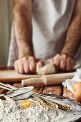 Handful of flour with egg yolks in a bakery