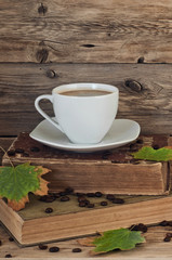 cup of coffee on the old books