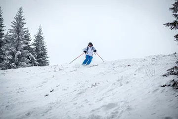 Fotobehang Man skiing on slope - winter holidays © Melinda Nagy