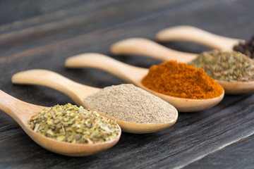 Spices and herbs in  bowls.