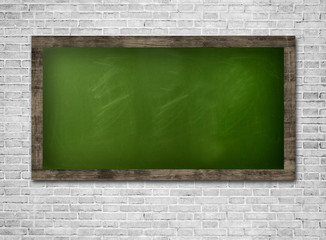 Blackboard on a white brickwall