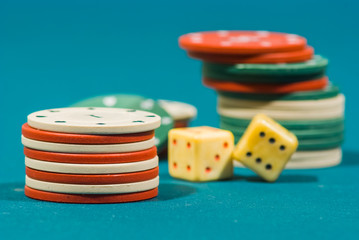 playing dices and chips on a green felt