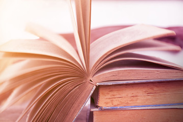 Old open book with soft light background 