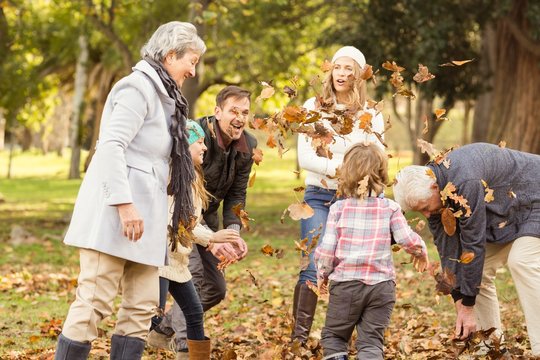 Happy Extended Family Throwing Leaves Around