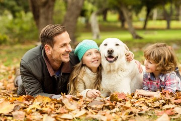 Smiling young family with dog