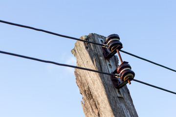 Power line conductor on old wooden pole