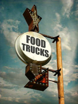 aged and worn vintage photo of food trucks sign