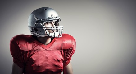 Composite image of american football player looking away