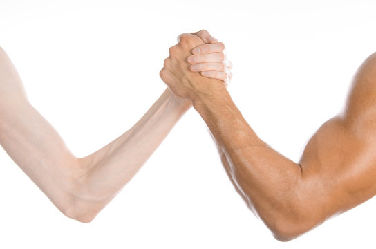 Bodybuilding & Fitness Topic: arm wrestling thin hand and a big strong arm isolated on white background in studio