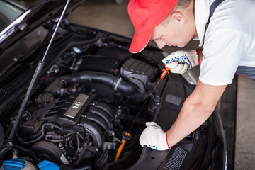 Mechanic changing oil