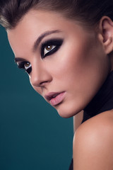 Fototapeta premium Beautiful young model with smoky eyes