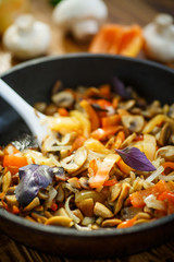fried mushrooms with peppers and onions