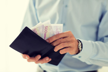 close up of businessman hands holding money