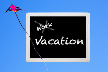 blackboard with words:'work-vacation'