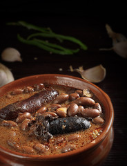Spanish fabada with Black pudding and sausage in an earthenware
