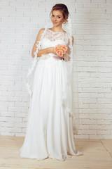 beautiful tender bride in elegant lace wedding dress