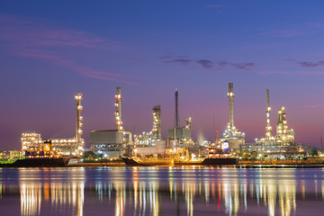 Naklejka premium Oil refinery along the river.