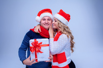 Lovely christmas couple holding presents