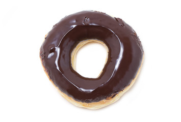 Close-up image of a chocolate glazed doughnut isolated on white