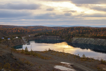 View of the flooded quarry Azure autumn neighborhood Nizhny Tagil