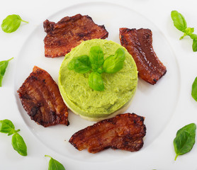 Served,ready to eat baked bacon with potato and broccoli puree