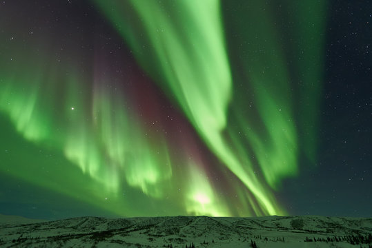 Aurora Borealis Northern Lights snowcapped mountains