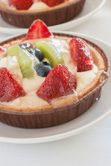 Fruit tarts filled with Strawberries Kiwi Fruit and Blueberries