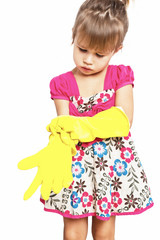 Little girl in rubber gloves in on the white background