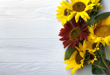 Sunflowers on a white wooden background